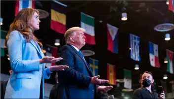  ?? AP Photo/Alex Brandon ?? President Donald Trump closes his eyes as he accepts blessings as he attends church at Internatio­nal Church of Las Vegas, on Sunday, in Las Vegas, Nev. Counselor to the President Hope Hicks is at left.