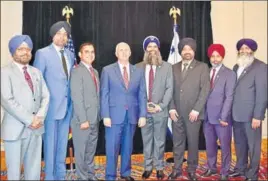  ??  ?? A Sikh delegation, led by SikhsPAC president Gurinder Singh Khalsa (fourth from right), met US vicepresid­ent Mike Pence in Indianapol­is on Friday.