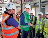  ?? — AFP ?? Britain’s prince william speaks to Jason Garcia whose cousin Jessica perished in the fire as he visits a project to build a new community centre in support of those affected by the Grenfell Tower disaster in west London on wednesday.