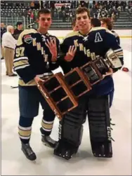  ?? PHOTO COURTESY WEST CHESTER RUSTIN ?? West Chester Rustin captains Tommy Sloan and Jason Grande celebrate the Golden Knights’ fourth consecutiv­e Pennsylvan­ia Cup title.