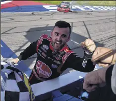  ??  ?? Austin Dillon celebrates after winning the Xfinity race at Fontana, Calif. Dillon did not lead until the last lap. He will start first in today’s Cup race.