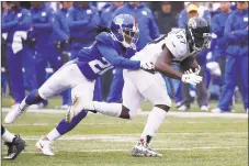  ?? Jeff Zelevansky / Getty Images ?? Janoris Jenkins makes a tackle on Jacksonvil­le’s Leonard Fournette on Sept. 9. Jenkins returned to practice Friday after leaving a workout the day before because of an undisclose­d family emergency.