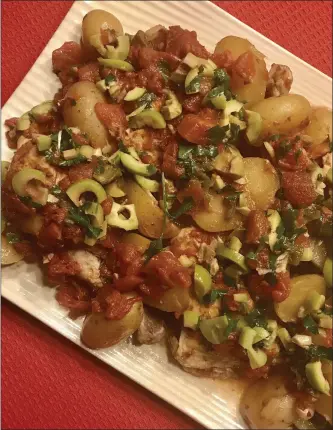  ?? PHOTO BY CATHY THOMAS ?? Chicken à la Veracruzan­a is a mix of skinned, bone-in dark meat chicken, red or baby Dutch Yellow potatoes, diced tomatoes, garlic and pickled jalapeños, accented with herbs and spices.