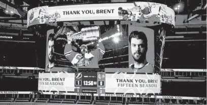  ?? CHRIS SWEDA / CHICAGO TRIBUNE ?? Retiring Blackhawks defenseman Brent Seabrook is honored during a timeout Friday at the United Center.