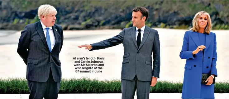  ?? ?? At arm’s length: Boris and Carrie Johnson with Mr Macron and wife Brigitte at the G7 summit in June