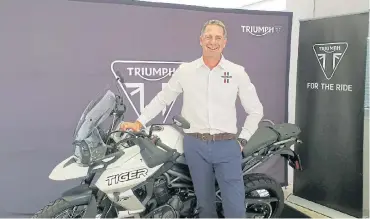  ??  ?? Bruce Allen, CEO of Triumph Motorcycle­s SA. Left: The Scrambler 1200 is a retro-styled, dual-purpose on- and off-road bike.