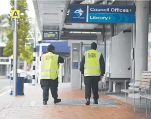  ?? PHOTO / GEORGE NOVAK ?? Security officers pictured in 2021 at Tauranga’s main CBD bus interchang­e on Willow St.