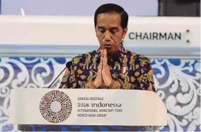  ?? AFP PIC ?? Indonesia President Joko Widodo delivering his speech at the Internatio­nal Monetary Fund and World Bank annual meetings in Nusa Dua yesterday.