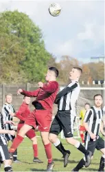  ??  ?? Debutant EK new boy Chris Love wins a header