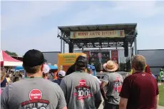  ?? (Caitlan Butler/News-Times) ?? President Bill Clinton congratula­tes El Dorado refinery workers for the plant’s continued success after 100 years. A centennial celebratio­n of the refinery was thrown by Delek, the refinery’s owner, on Saturday at the MAD Amp.