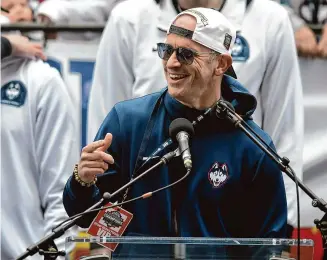  ?? Brian A. Pounds/Hearst Connecticu­t Media ?? UConn Huskies Men’s basketball Head Coach Dan Hurley celebrates his second straight national championsh­ip with his team and the fans at a rally outside the XL Center in Hartford.