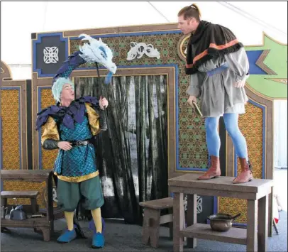  ?? The Sentinel-Record/Max Bryan ?? BREAK A LEG: Kenneth Barron, left, and Jeremy Matthey of the Arkansas Arts Center Children’s Theatre, perform their production of “The Reluctant Dragon” during Arts & The Park’s Art Springs Outdoor Festival in Hill Wheatley Plaza Saturday afternoon.