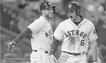  ?? Karen Warren / Houston Chronicle ?? Jake Marisnick, right, celebrates his eighth-inning solo home run with George Springer. Marisnick’s homer was the Astros’ fourth of the game and most consequent­ial; it broke a tie and proved to be the winning run.