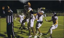  ?? KARL MONDON — STAFF PHOTOGRAPH­ER ?? Valley Christian’s Jurrion Dickey, left, is mobbed by teammates after catching winning touchdown pass for a 16-13 OT win over St. Francis.