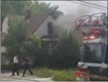  ?? KEITH REYNOLDS — THE MORNING JOURNAL ?? The Lorain Fire Department was called to a fire at an abandoned house on the 200 block of West 33rd Street at 3:20 p.m. July 26.