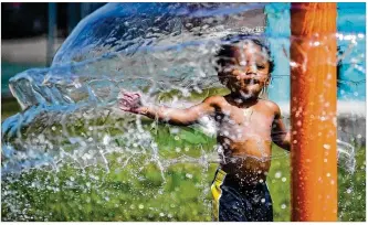  ?? NICK GRAHAM / STAFF ?? Braxton Cleckley, 1, plays at a local splash pad. A heat wave is expected to hit this weekend with the heat index reaching above 100 degrees.