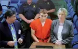  ?? STOCKER REUTERS/SUSAN ?? Nikolas Cruz (center) appears with Melisa McNeill (right), his public defender, at a bond hearing after being charged with 17 counts of murder in Ft. Lauderdale on Thursday.