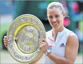  ??  ?? Angelique Kerber with the winner's trophy on Saturday night.