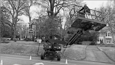  ?? K.T. McKee, File ?? A member of a “Stranger Things” film support crew maneuvers a special lift at the Claremont House on March 4, 2020.