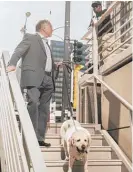  ??  ?? A security guard confronts Jeffrey Graubart as hewalksWri­ggles down the steps to the riverwalk Friday afternoon.