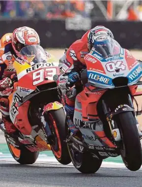  ?? EPA PIC ?? Andrea Dovizioso (right) and Marc Marquez in a close battle during the Thailand MotoGP yesterday.