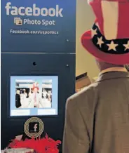  ?? Mladen Antonov / AFP / Getty Images ?? A delegate to the Republican National Convention poses in the Facebook photo booth in Tampa, Fla.