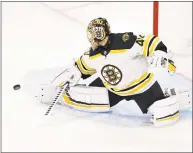  ?? Grant Halverson / Getty Images ?? The Bruins’ Tuukka Rask makes a save against the Hurricanes during Game 3 of the Eastern Conference finals Tuesday.