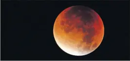  ?? [KERSTIN JOENSSON/THE ASSOCIATED PRESS] ?? The moon will turn red over the United States on Sunday night during the last total lunar eclipse of the decade.