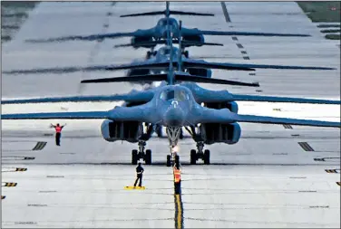  ?? The New York Times/U.S. Air Force/TECH. SGT. RICHARD P. EBENSBERGE­R ?? Four Air Force B-1B bombers arrive at Andersen Air Force Base in the U.S. Pacific territory of Guam on Feb. 6. North Korea vowed Wednesday to finalize a plan by mid-August to fire four mid-range missiles hitting waters 19 to 25 miles away from the...