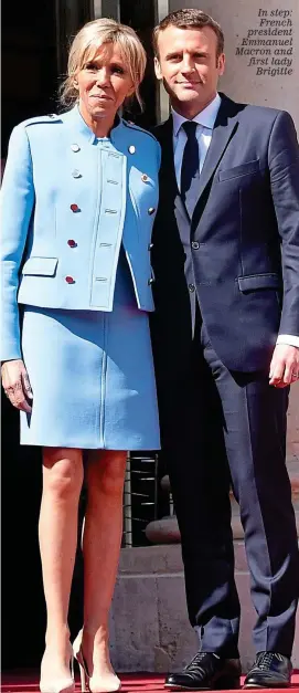  ??  ?? In step: French president Emmanuel Macron and first lady Brigitte