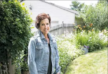  ??  ?? Geri Delaney poses in front of her favorite section of her Mt. Lebanon garden.