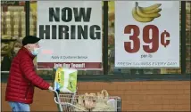  ?? TONY DEJAK — THE ASSOCIATED PRESS FILE ?? A shopper leaves a Marc’s Store in Mayfield Heights, Ohio. With viral cases declining, consumers spending again and more businesses easing restrictio­ns, America’s employers are looking for workers.