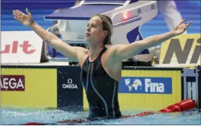  ?? LEE JIN- MAN — THE ASSOCIATED PRESS ?? Italy’s Federica Pellegrini celebrates after winning the women’s 200- meter freestyle final at the World Swimming Championsh­ips in Gwangju, South Korea on Wednesday.