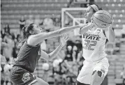  ?? [PHOTO BY BRYAN TERRY, THE OKLAHOMAN] ?? Oklahoma State’s Loryn Goodwin, right, was selected by Dallas in the second round of the WNBA Draft on Thursday night.