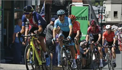  ?? AP PHOTO/RICH PEDRONCELL­I ?? The leaders of the second stage of the Amgen Tour of California cycling race sprints along Main Street on Monday, in Placervill­e, Calif.