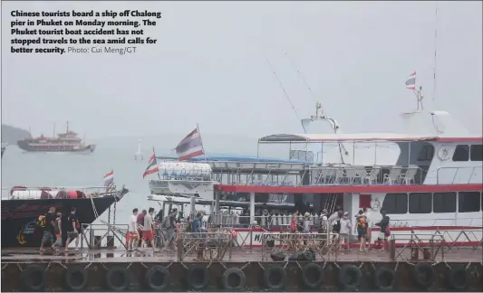  ?? Photo: Cui Meng/GT ?? Chinese tourists board a ship off Chalong pier in Phuket on Monday morning. The Phuket tourist boat accident has not stopped travels to the sea amid calls for better security.