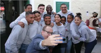  ??  ?? US deputy consul-general Will Stevens with the George Youth Council at the Old Gaol in Knysna.