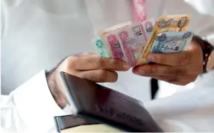  ??  ?? CAUSE FOR CHEER: Salaries in the UAE are projected to increase 4.8 per cent next year. — File photo