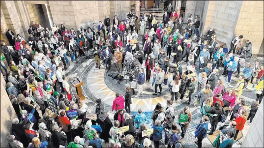  ?? Margery A. Beck The Associated Press ?? Hundreds of people crowd the Nebraska State Capitol Rotunda Wednesday in Lincoln. Neb., to protest a so-called heartbeat bill that would outlaw abortion once cardiac activity can be detected in an embryo, generally near the sixth week of pregnancy.