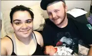  ?? Photo submitted ?? Alissa Barnes, her boyfriend Traey Burge and their son Kenneth Ray settle in at home after Kenneth’s birth on March 14.