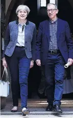  ??  ?? CHURCH Mrs May and husband yesterday