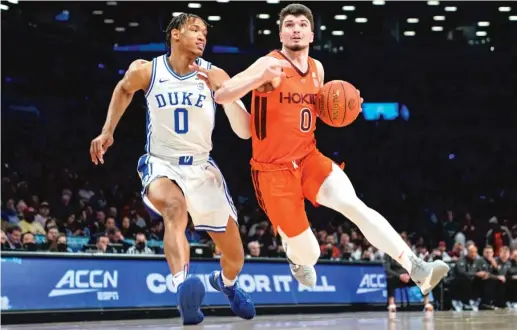  ?? AP ?? Virginia Tech’s Hunter Cattoor, driving past Duke’s Wendell Moore Jr., scored a career-high 31 points in the ACC tournament championsh­ip game Saturday.