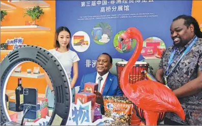  ?? PROVIDED TO CHINA DAILY ?? South Africa’s Ambassador to China Siyabonga C. Cwele (center) promotes African products via livestream­ing during the Online Shopping Festival Featuring Quality African Products in Changsha, Hunan province, on Wednesday.