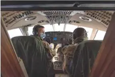  ?? — AFP photos ?? French Navy personnel onboard a Falcon 200 Guardian fly above the Yellow Sea between Korea and China to scan the ocean surface for signs of illegal ship-to-ship transfers headed for North Korea.