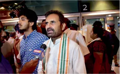  ?? PTI ?? Guajrat Congress MLA and spokespers­on Shaktisinh Gohil talking to media at the Bengaluru airport on Monday morning, as party MLAs leave after camping at a private resort near Bengaluru for 10 days. —