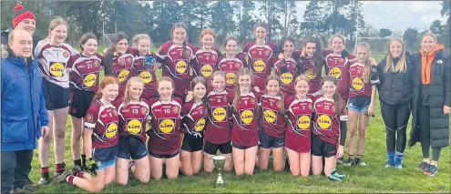  ?? ?? The Presentati­on Mitchelsto­wn First Year girls, who were crowned county champions having defeated Youghal, pictured with their mentors.