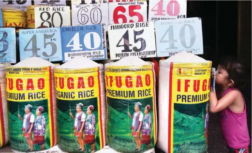  ??  ?? PRICE WATCH – Rice is one of the eight basic food items with suggested retail prices or SRPs that took effect in Metro Manila starting Monday. (Jansen Romero)