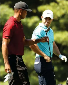  ?? GETTY IMAGES ?? Error-riden: Tiger Woods and Rory McIlroy