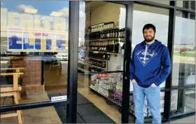  ?? PILOT NEWS GROUP PHOTO/ ANGELA CORNELL ?? Chase Davis, pictured here in front of his store located at 2287 N. Oak Rd., is eager to help people meet their health and strength goals. He also offers smoothies and a meal prep service.