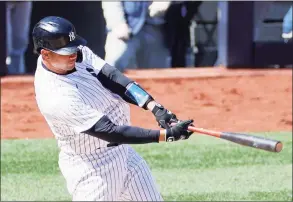  ?? Sarah Stier / Getty Images ?? The Yankees’ Gary Sanchez hits a home run during the fourth inning against the Toronto Blue Jays at Yankee Stadium on Saturday.